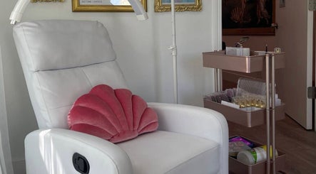 Luxury treatment chair at Birth of Venus in Los Gatos, California, US. Features elegant pink velvet cushion.