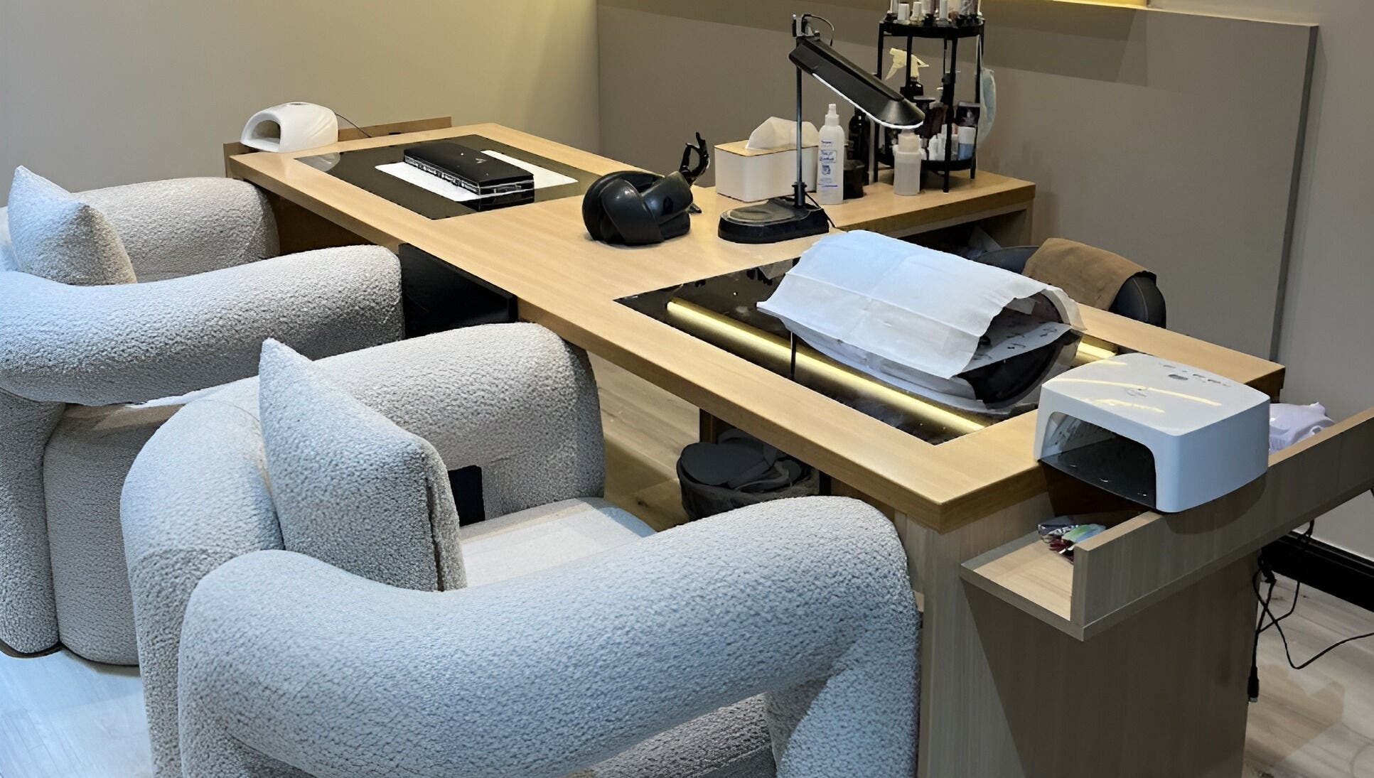 Modern nail care station at ZK Beauty & Spa, Muscat, Muscat Governorate, OM with plush seating and equipment.