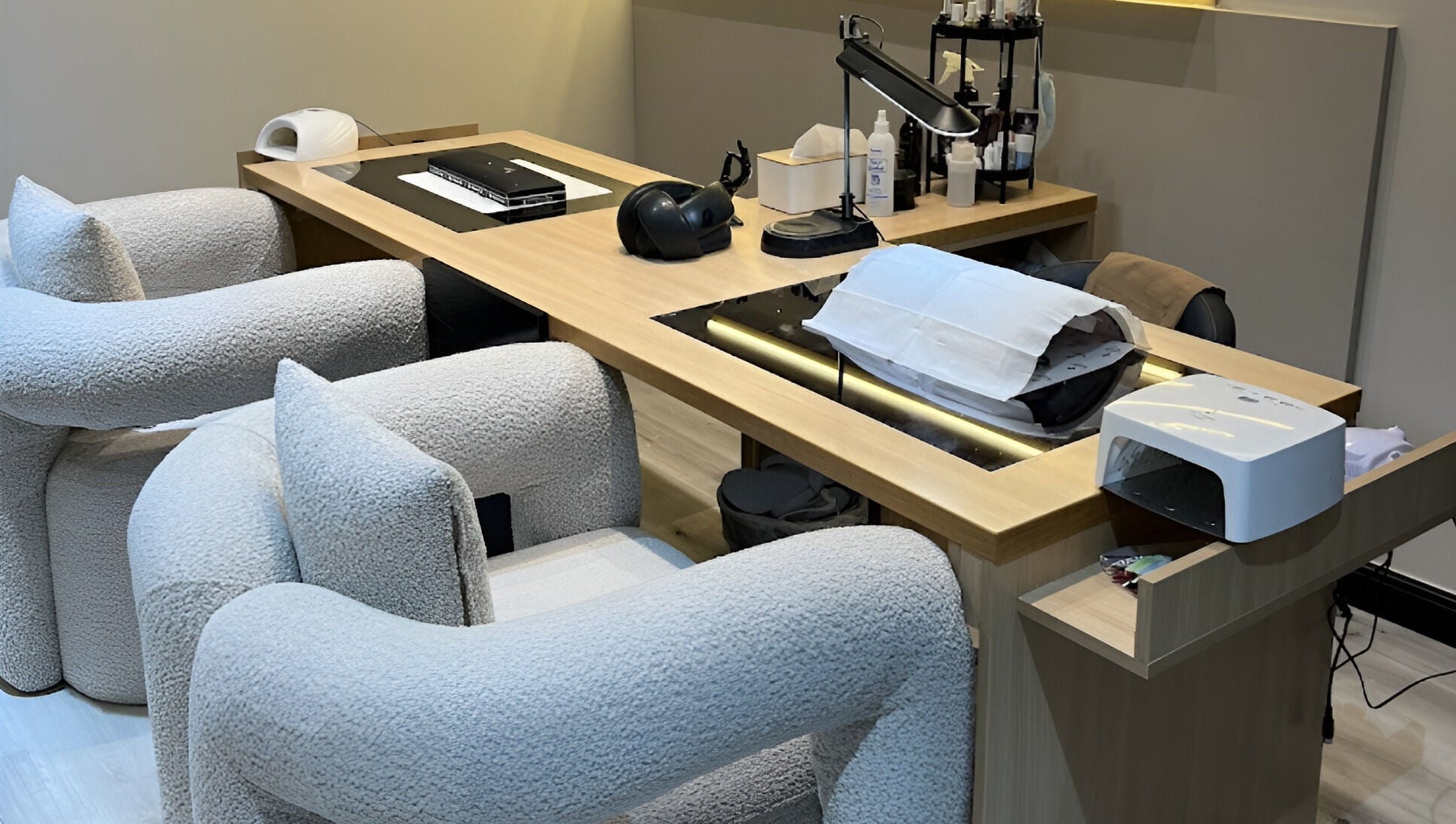 Modern nail care station at ZK Beauty & Spa, Muscat, Muscat Governorate, OM with plush seating and equipment.