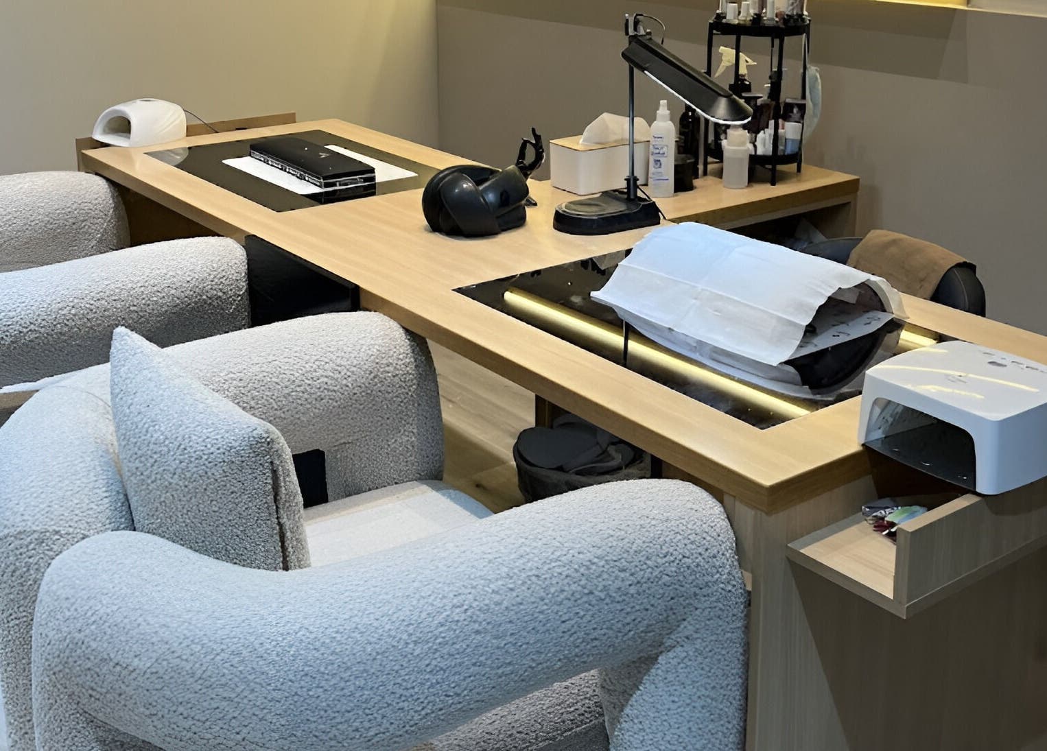 Modern nail care station at ZK Beauty & Spa, Muscat, Muscat Governorate, OM with plush seating and equipment.