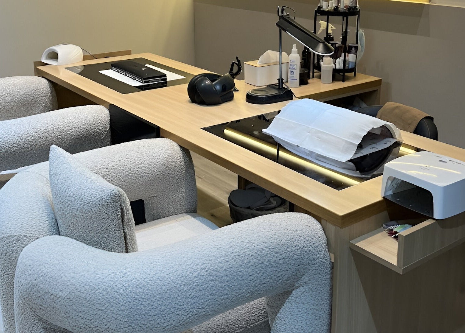 Modern nail care station at ZK Beauty & Spa, Muscat, Muscat Governorate, OM with plush seating and equipment.