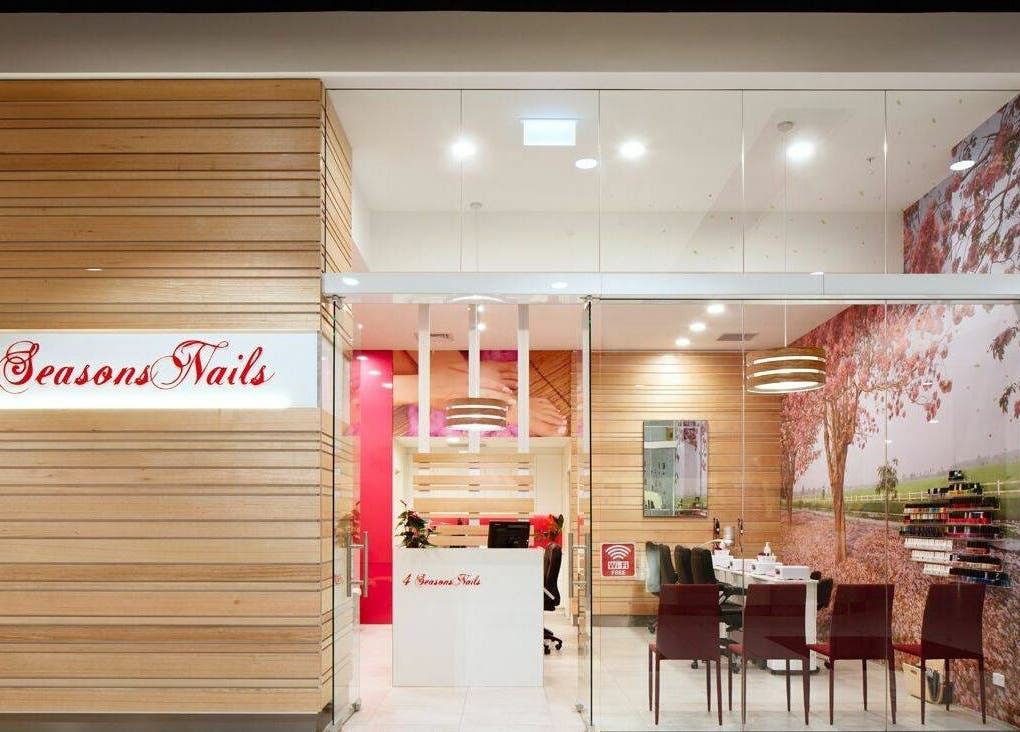 4 Seasons Nails Queensgate entrance in Lower Hutt, Wellington, NZ showcasing elegant decor and nail polish display.