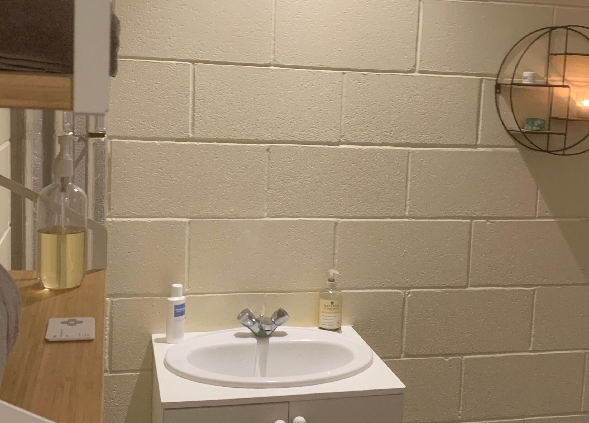 Tranquil setting at Fois - Mercat Gait Centre, Prestonpans, Scotland, GB featuring a cozy vanity and soft lighting.