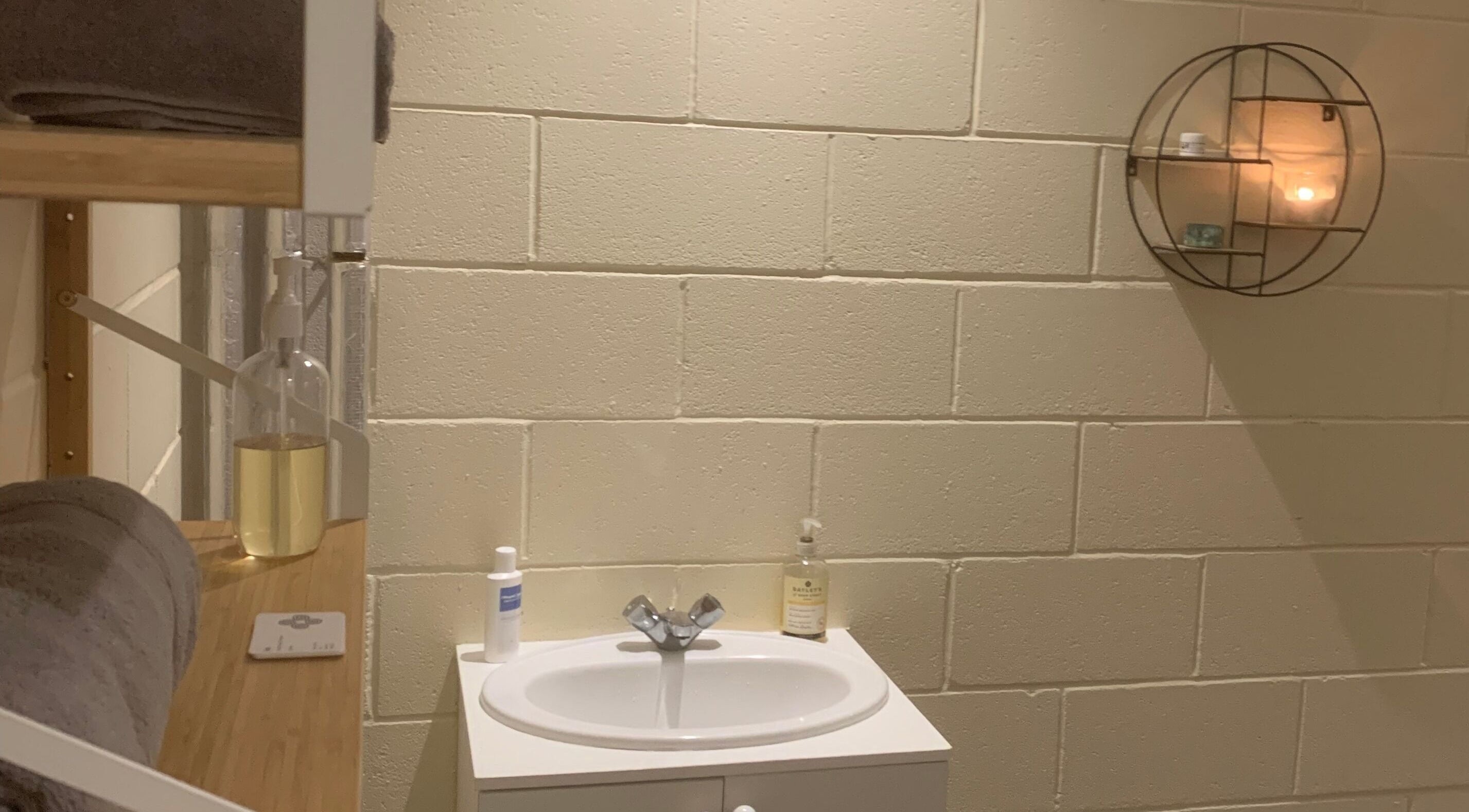 Tranquil setting at Fois - Mercat Gait Centre, Prestonpans, Scotland, GB featuring a cozy vanity and soft lighting.