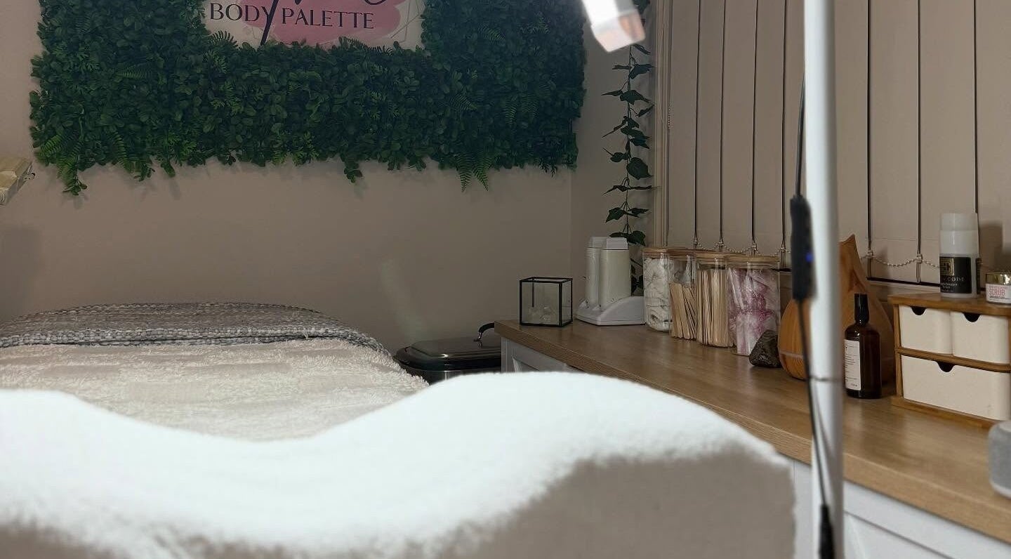 Serene treatment room at The Body Palette in Coffs Harbour, New South Wales, AU, featuring a cozy spa bed.