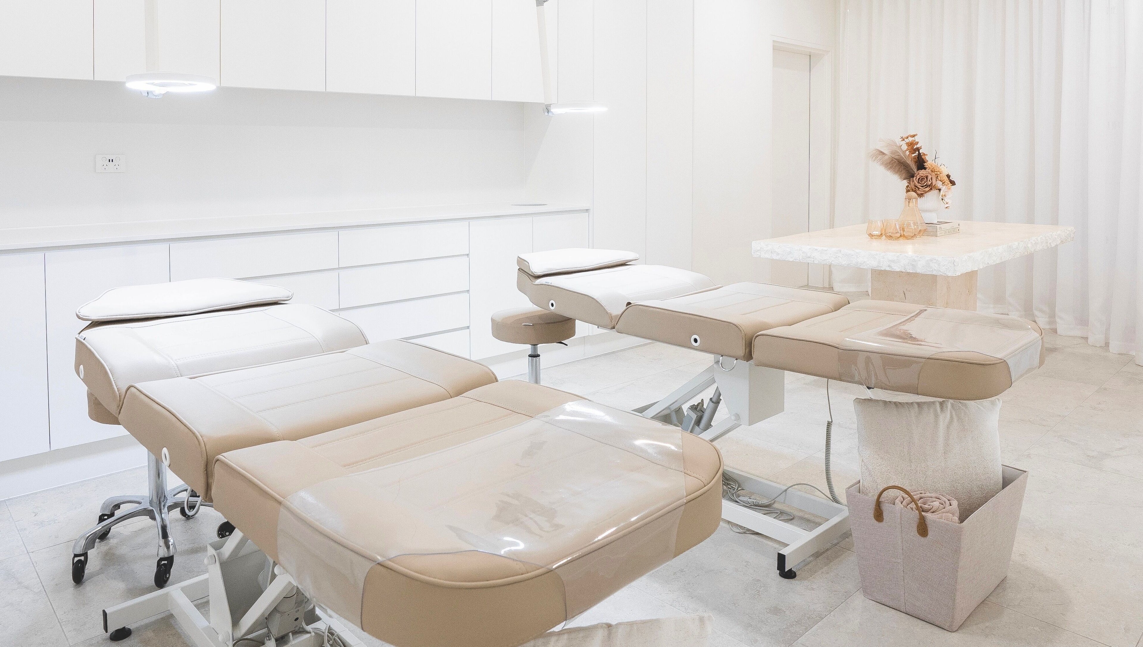 Modern treatment room at Brow Foxx Wollongong in Corrimal, New South Wales, AU featuring comfortable beds.