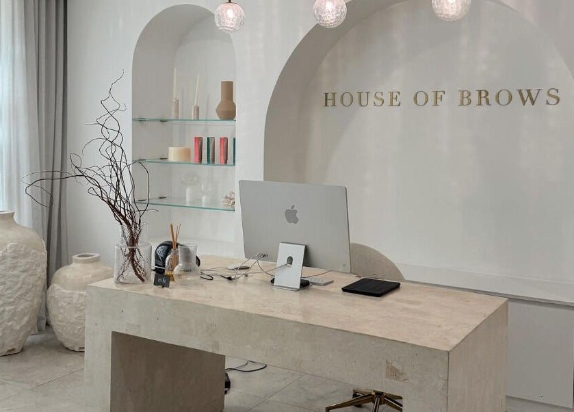 Elegant reception area at Brow Foxx Wollongong in Corrimal, New South Wales, AU, showcasing modern decor and style.