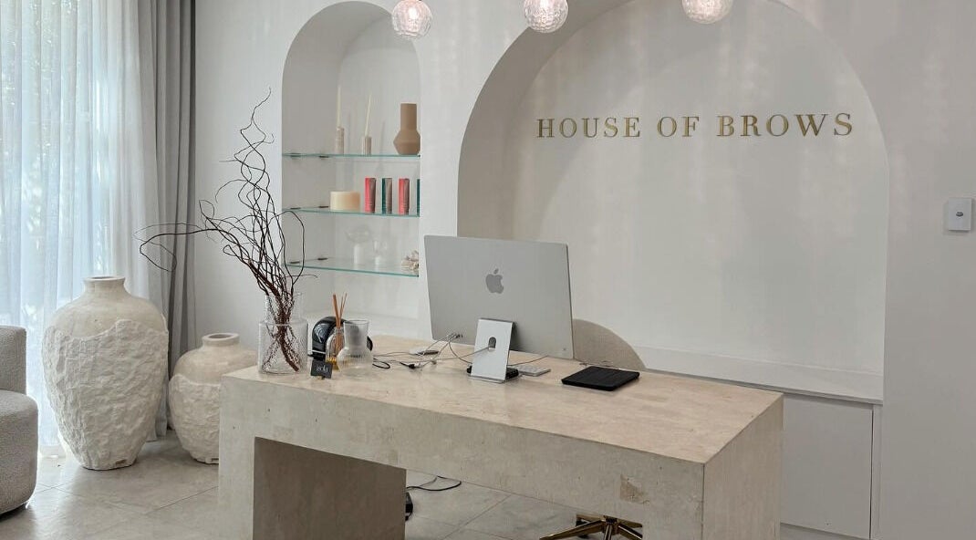 Elegant reception area at Brow Foxx Wollongong in Corrimal, New South Wales, AU, showcasing modern decor and style.