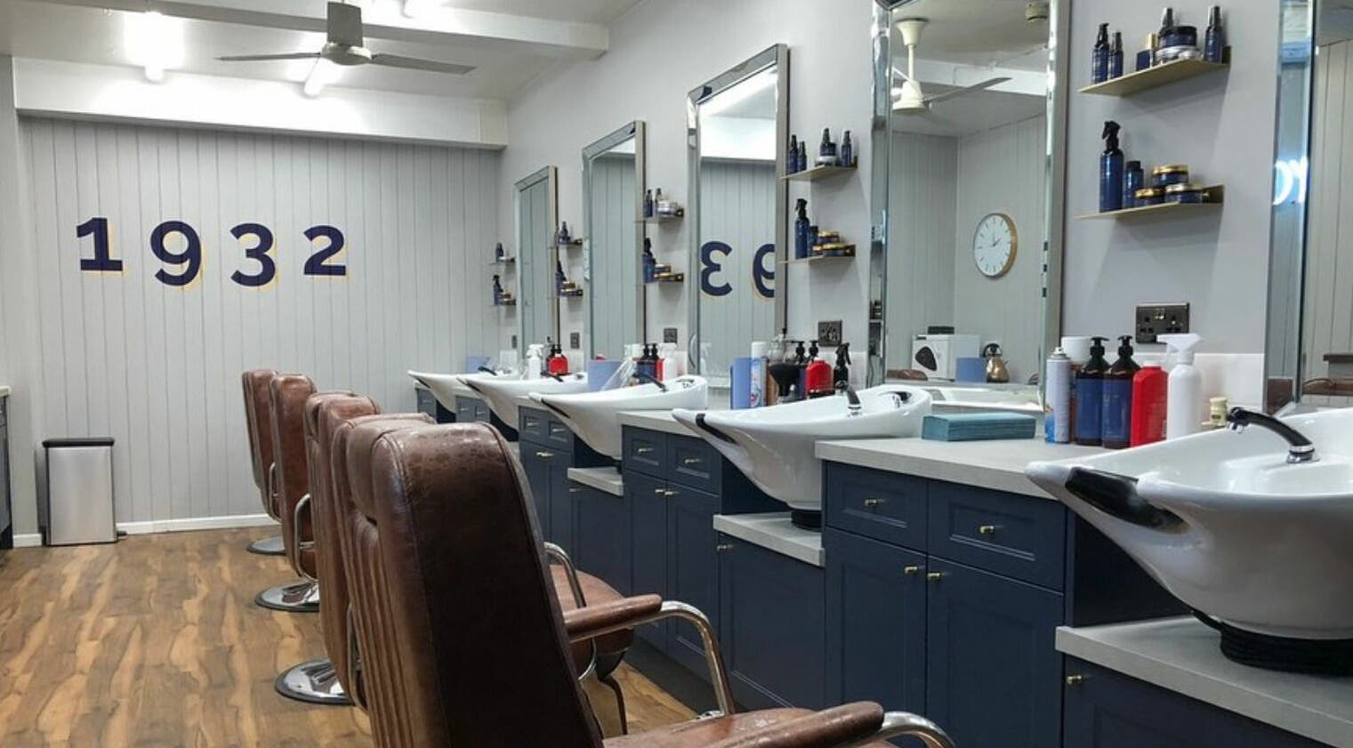 Vintage barber chairs and sleek sinks at Youngmans Marlow, Marlow, England, GB.