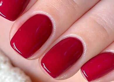 Crimson nails polished to perfection at Refined Beauty By Roxanne in Reigate, England, GB.