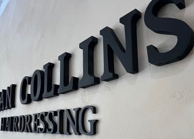 SC Hairdressing signage at Clydebank, Scotland, GB venue, showcasing modern aesthetic.
