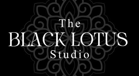 Elegant emblem for The Black Lotus Studio in Yarm, England, GB on a dark floral background.