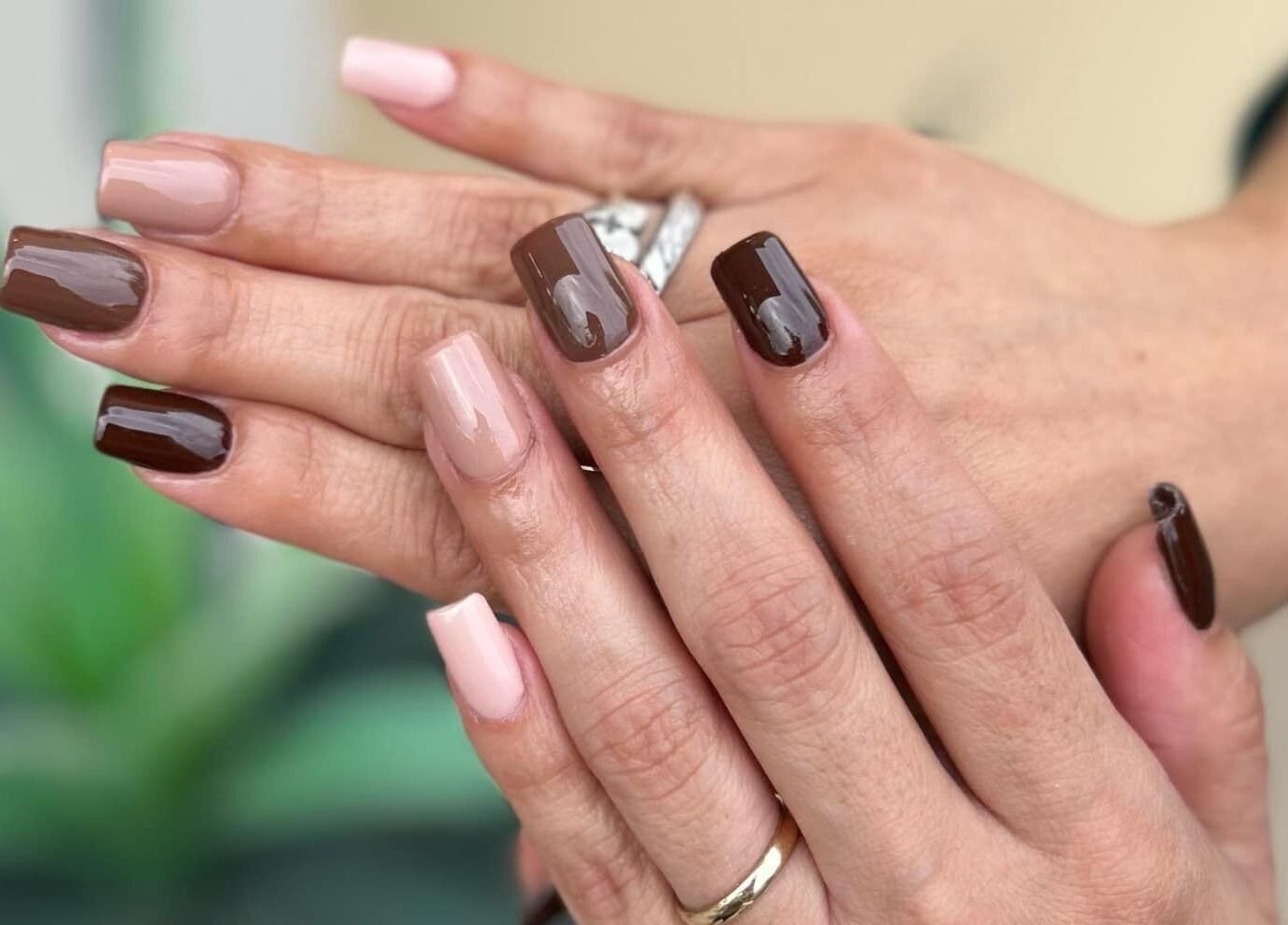 Elegant brown and nude manicure at Lovely Me Nail Studio in Laredo, Texas, US.