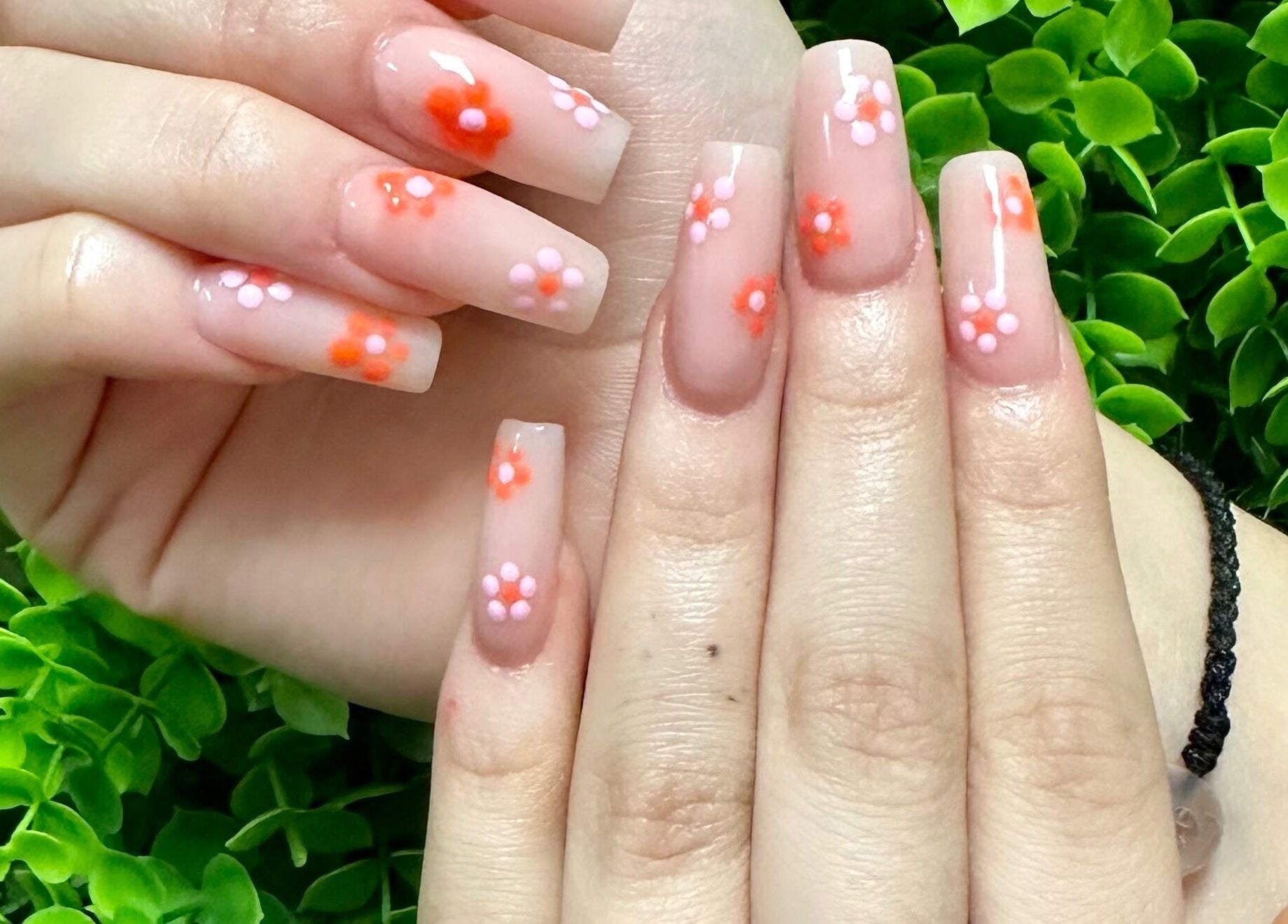 Floral nail art design at Lovely Me Nail Studio in Laredo, Texas, US, showcasing intricate flower patterns.
