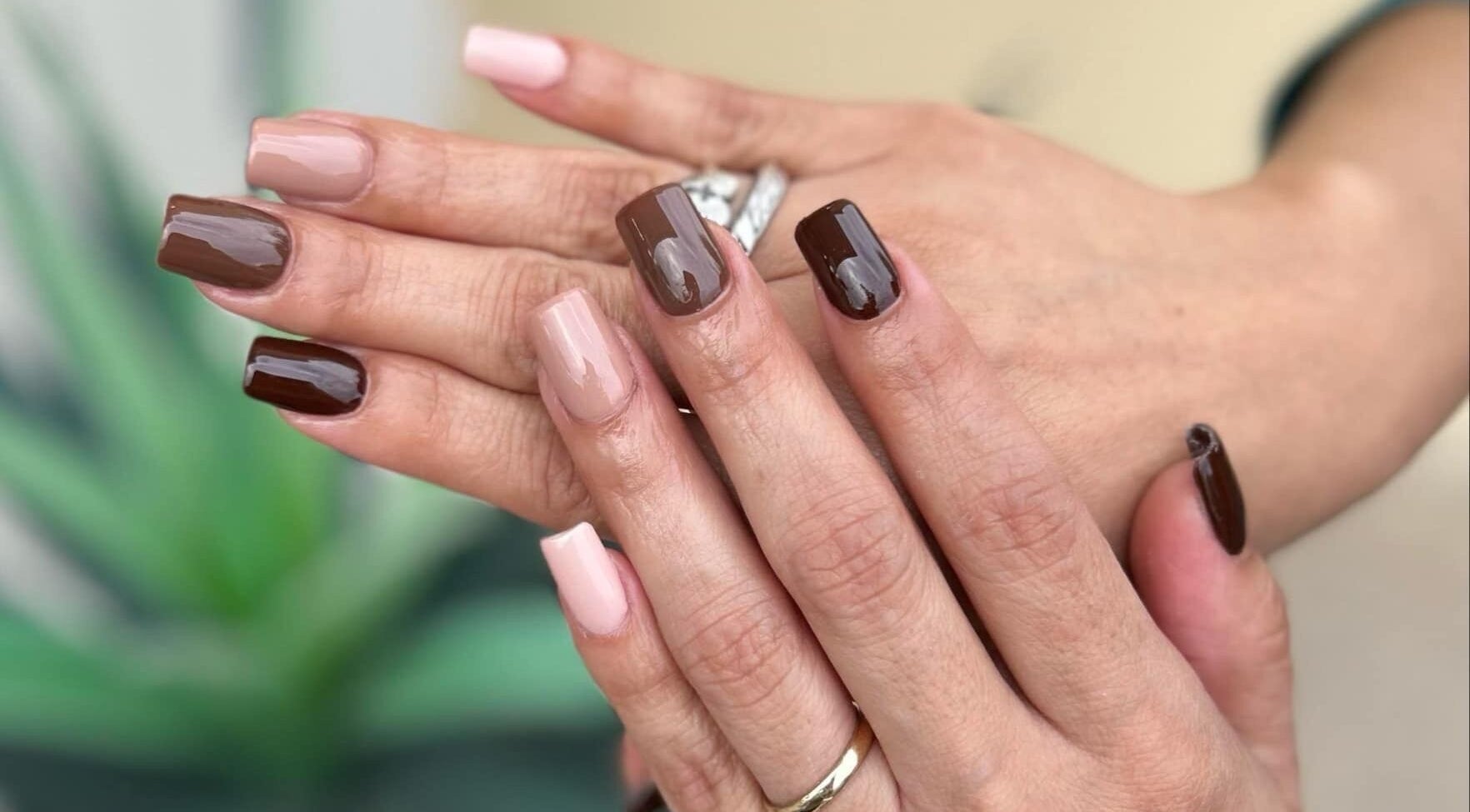 Stylish brown and nude nails at Lovely Me Nail Studio, Laredo, Texas, US.