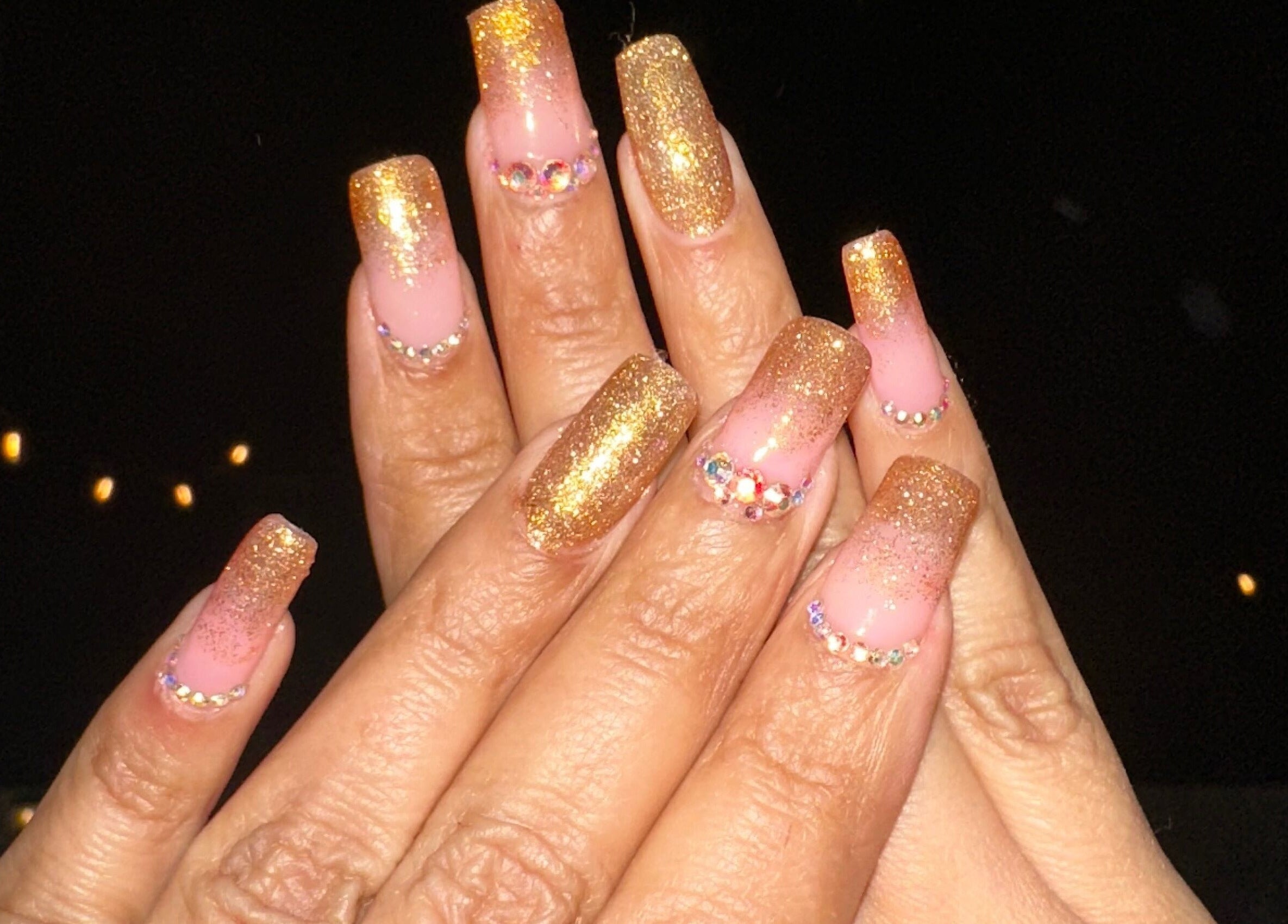 Stunning golden glitter nails design at Lovely Me Nail Studio, Laredo, Texas, US.
