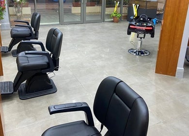 Modern styling chairs at Volume Gents Salon, Dubai, AE, showcasing contemporary interior design.
