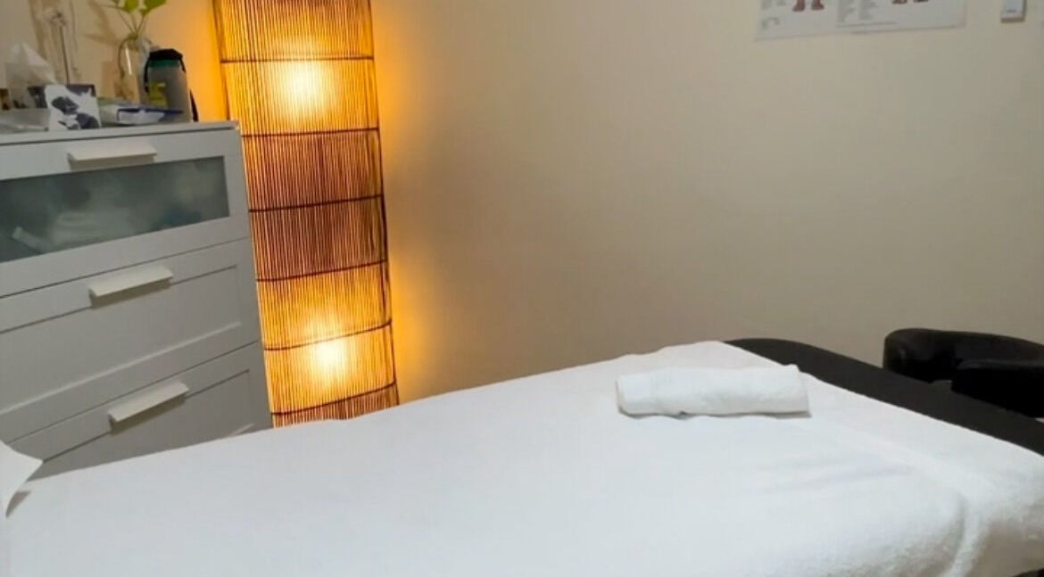 Relaxing massage room at Primal Bodies Massage in Auchenflower, Queensland, AU with soft lighting.