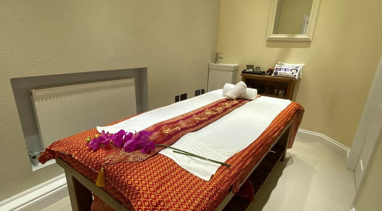 Tranquil massage room at Siam Thara in Borehamwood, England, GB with decorative elements.