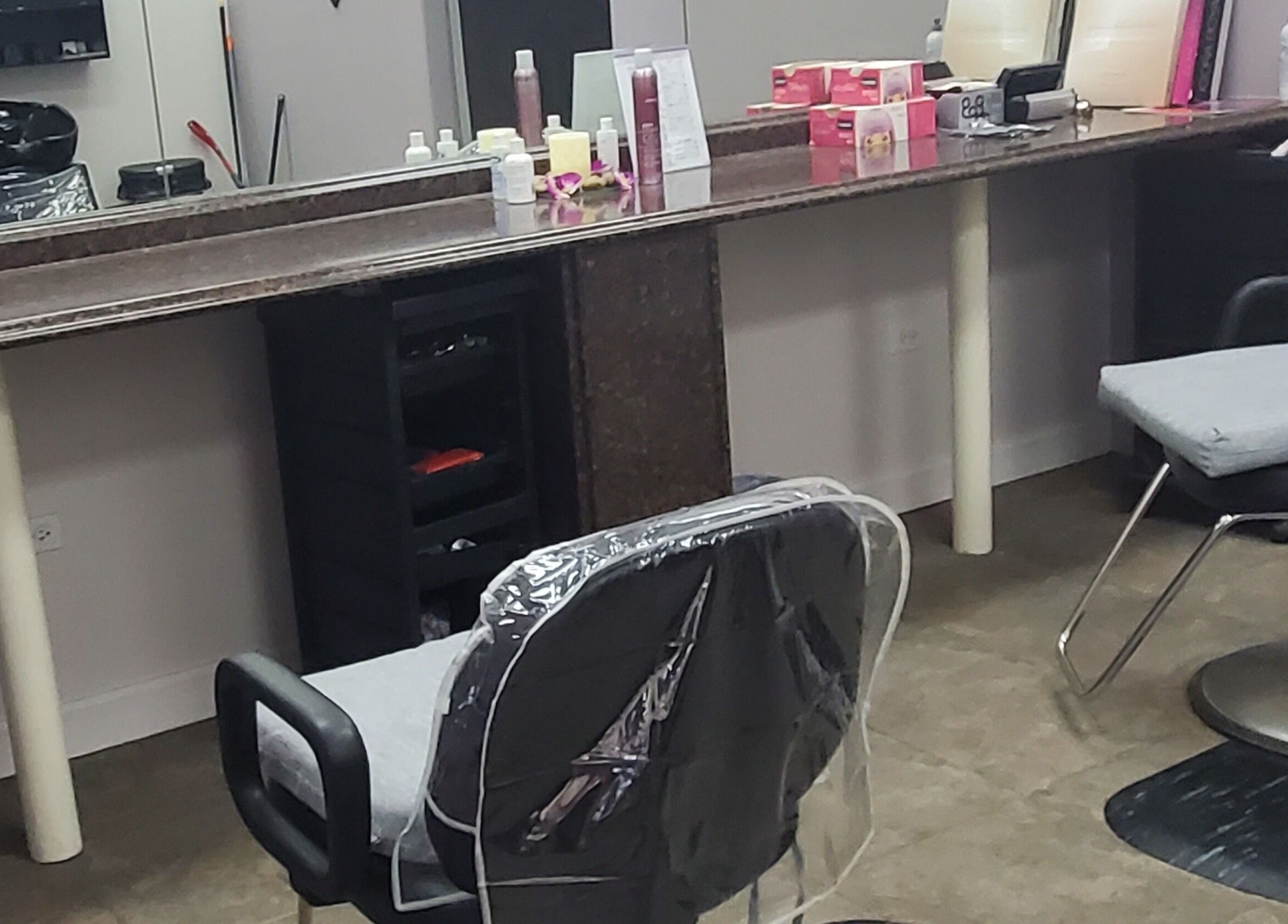 Modern styling chairs at Illusions Salon Co in Round Lake, Illinois, US, offering a serene beauty experience.