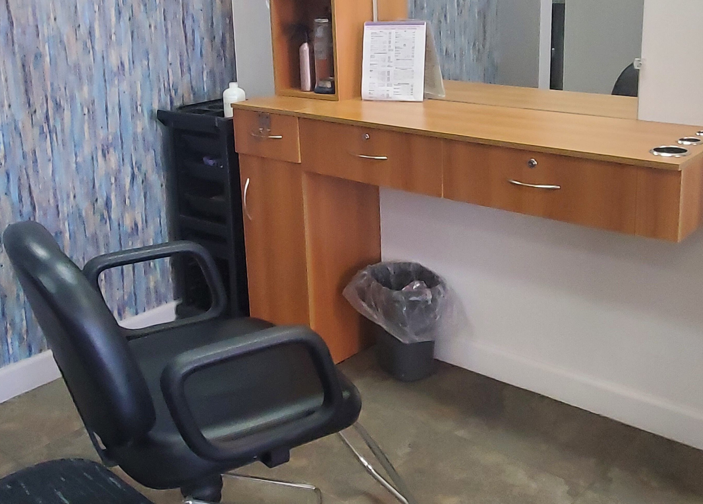 Modern styling chair and wood vanity at Illusions Salon Co, Round Lake, Illinois, US.