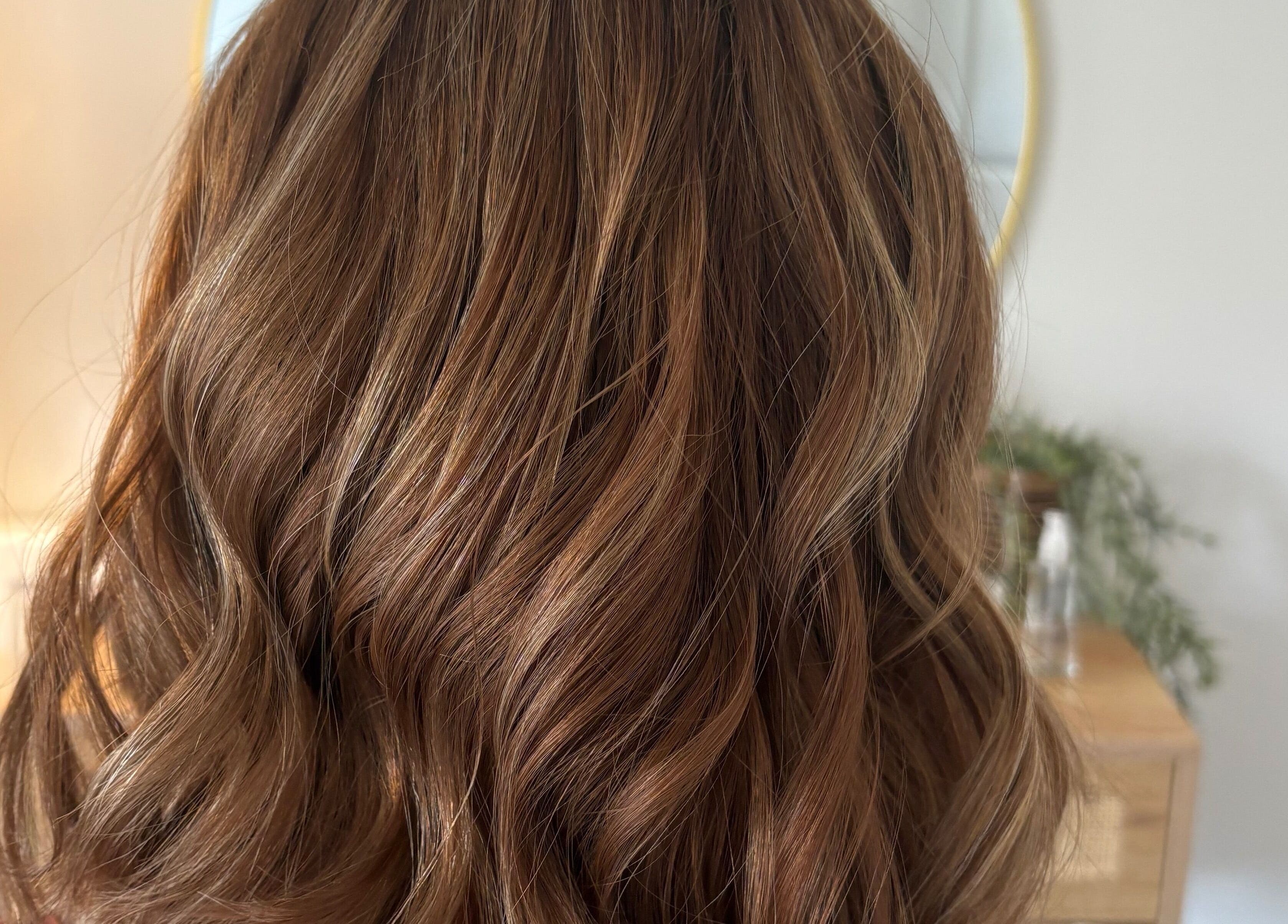 Beautiful wavy hairstyle created by Hairbysarah in Chichester, England, GB, showcasing soft brown curls.