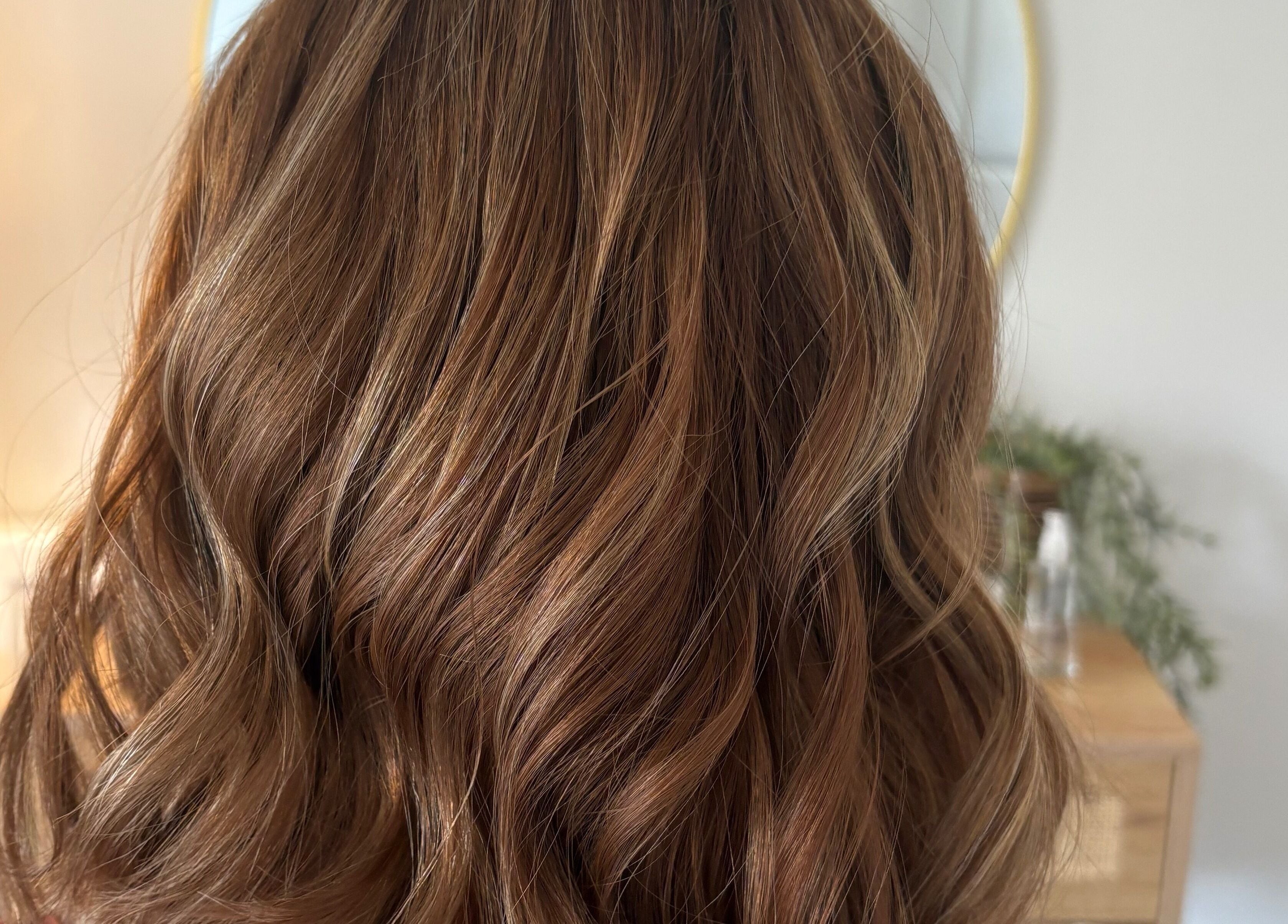 Beautiful wavy hairstyle created by Hairbysarah in Chichester, England, GB, showcasing soft brown curls.