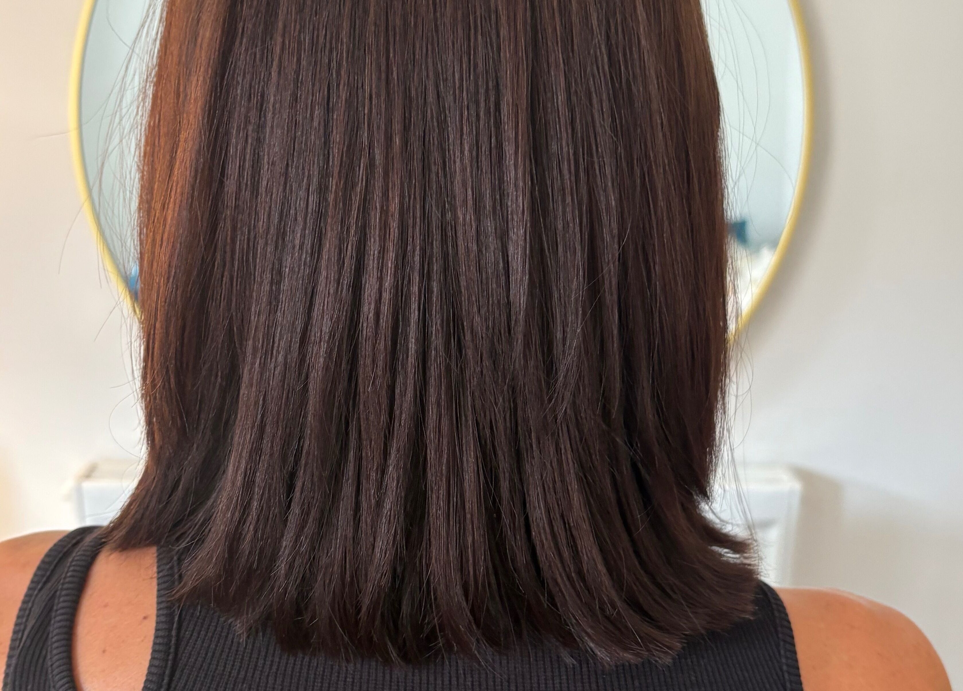 Smooth brunette bob hairstyle at Hairbysarah in Chichester, England, GB, reflecting chic salon ambiance.