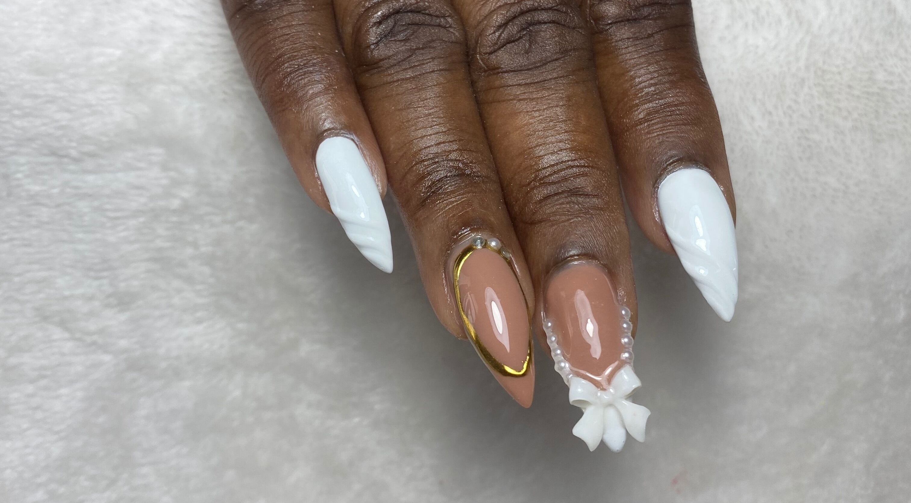 Chic nail art with white and nude polish at Reign Nail Studio, Saint Michael, BB.