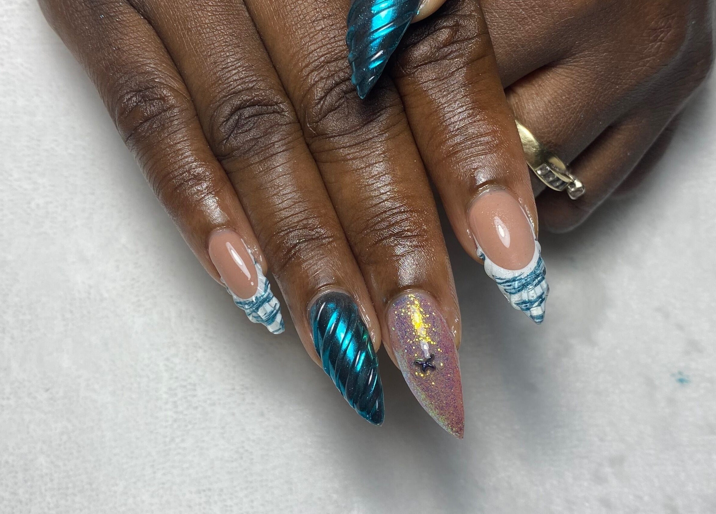 Stylish nail art with blue and glitter design at Reign Nail Studio, Saint Michael, Saint Michael, BB.