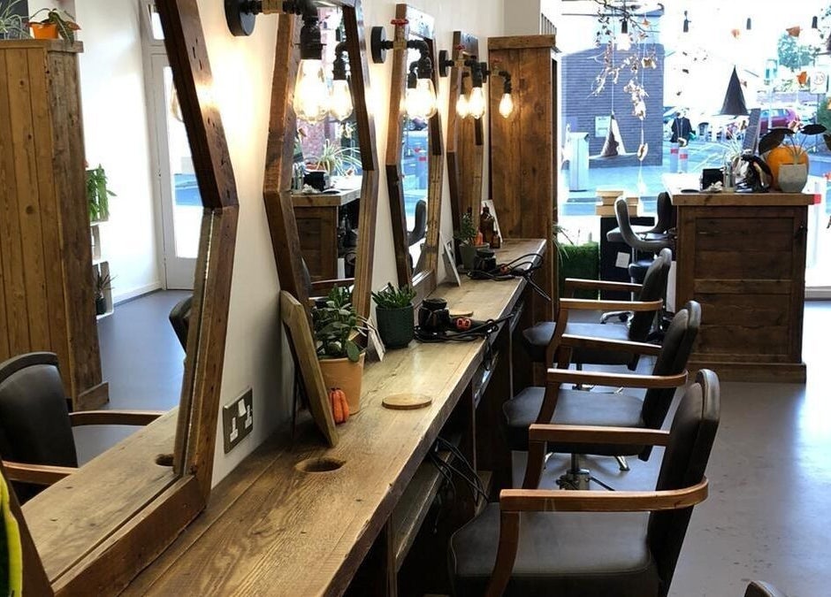 Chic interior of Her Studio, Grimsby, England, GB with stylish wood decor and elegant styling stations.