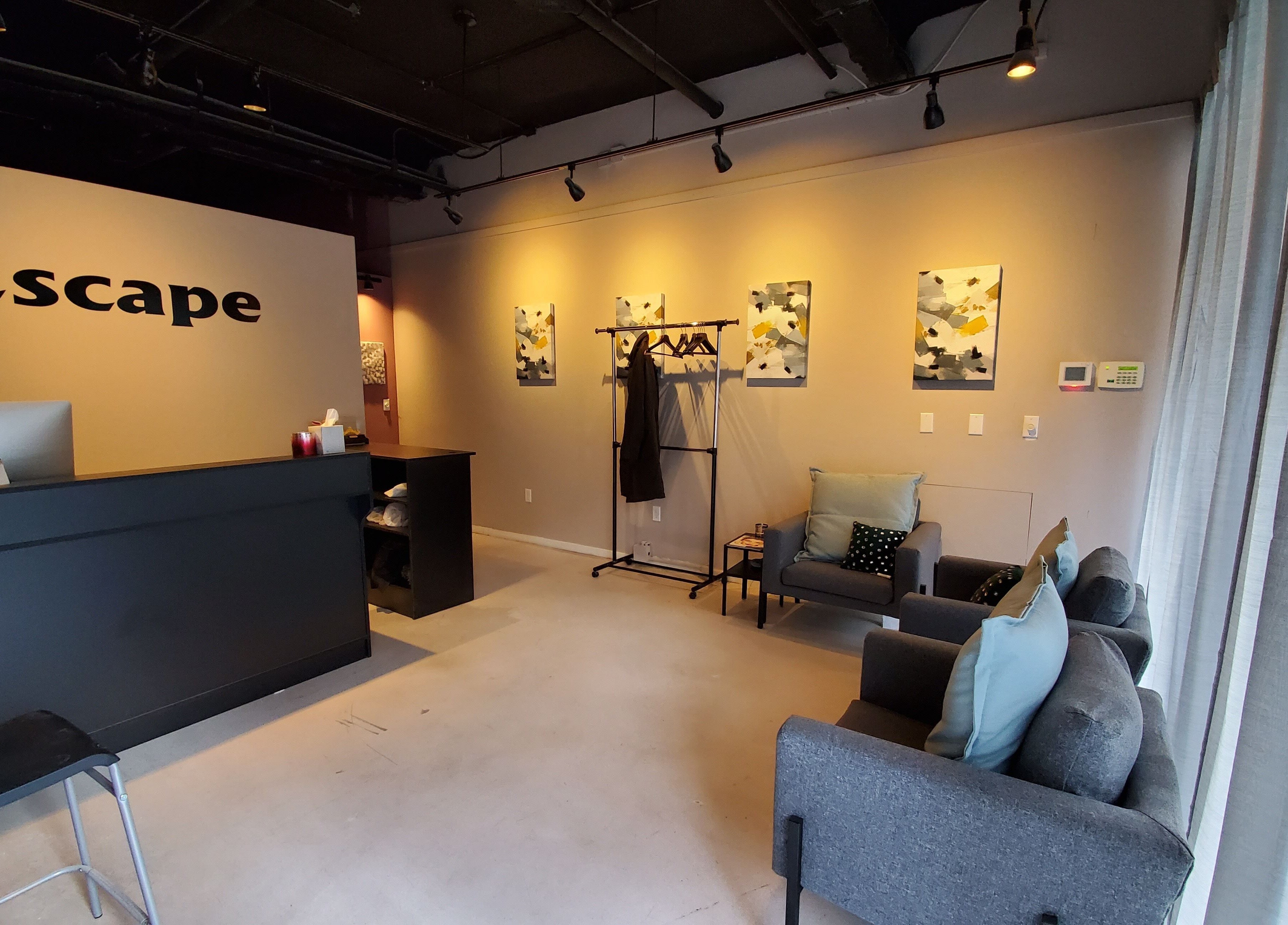 Modern reception area at ESCAPE, New York, New York, US, with stylish decor and cozy seating.