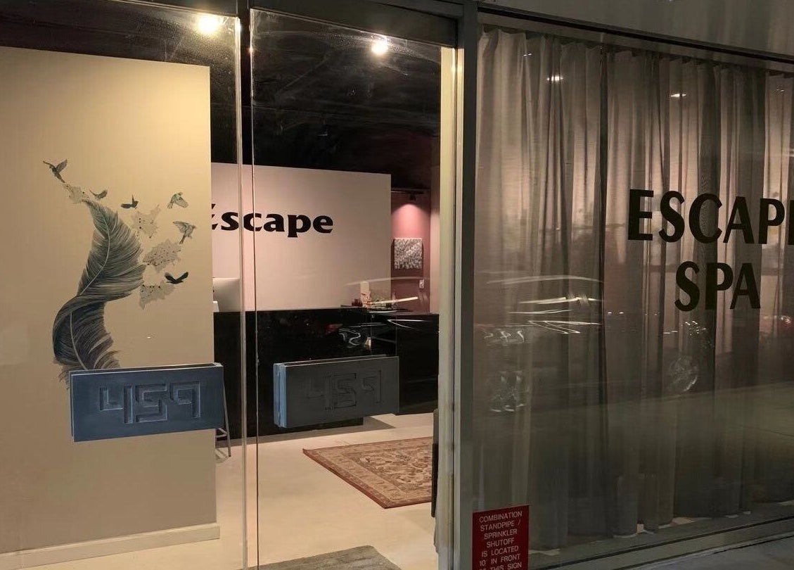 Entrance to ESCAPE spa with elegant decor in New York, New York, US, showcasing a peaceful ambiance.
