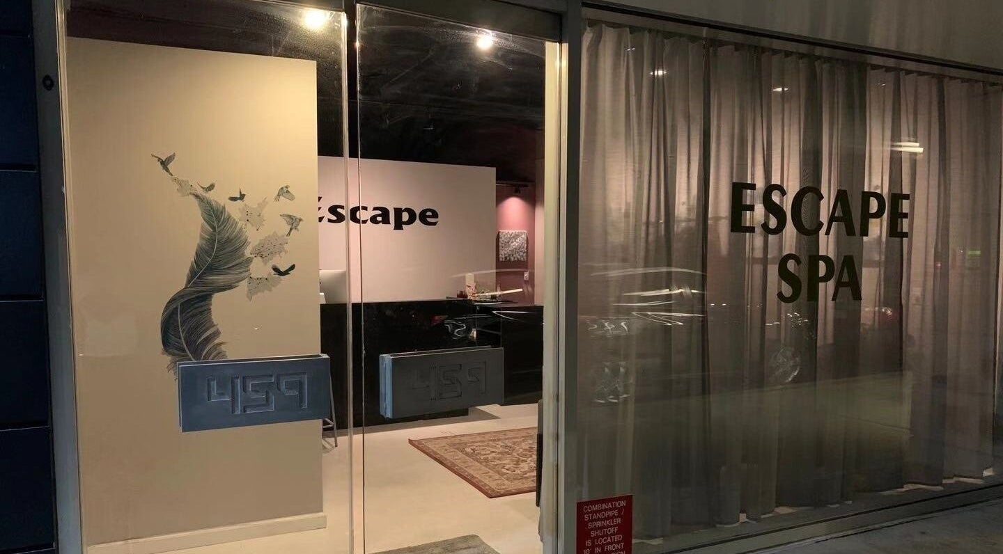 Entrance to ESCAPE spa with elegant decor in New York, New York, US, showcasing a peaceful ambiance.
