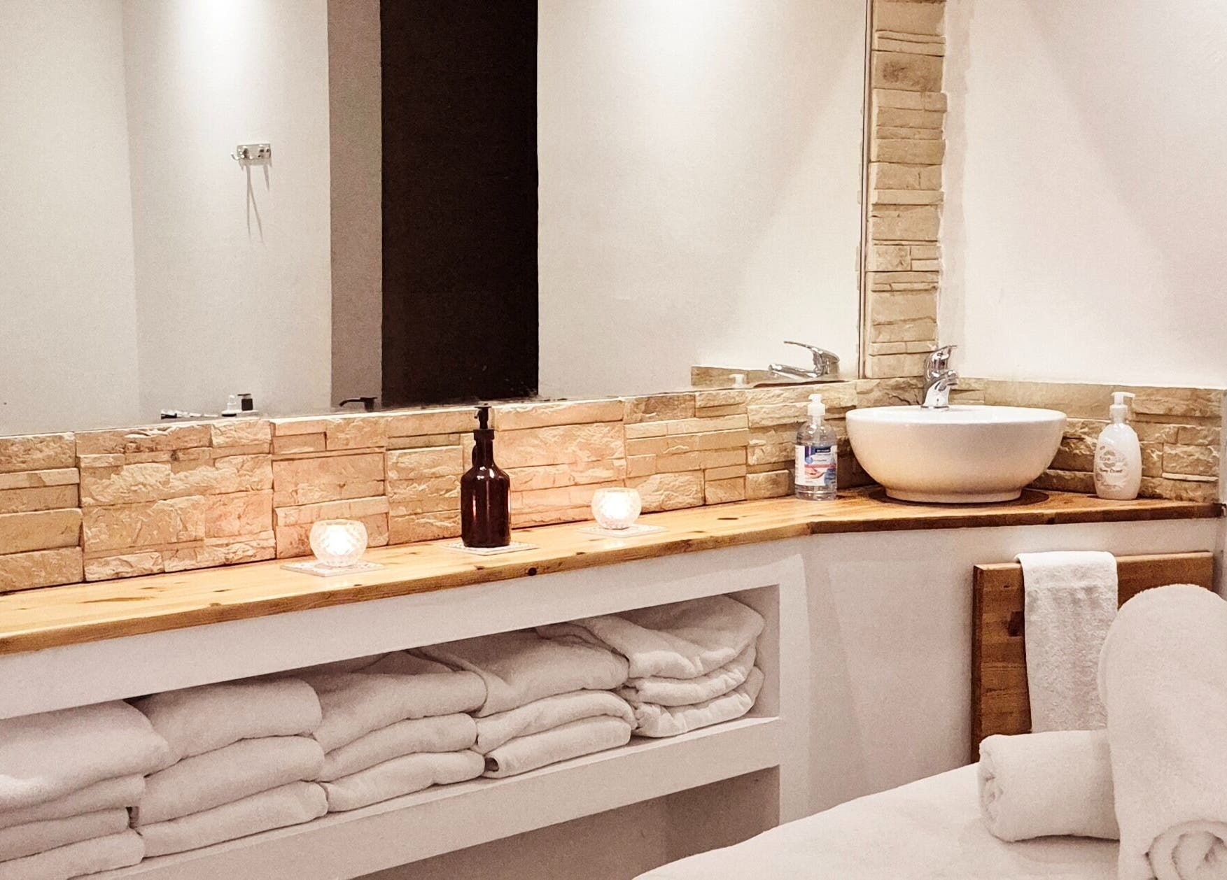 Relaxing spa room at Blue Spa at Nausicaa Beach Hotel, Protaras, Ammochostos, CY with towels and soothing decor.