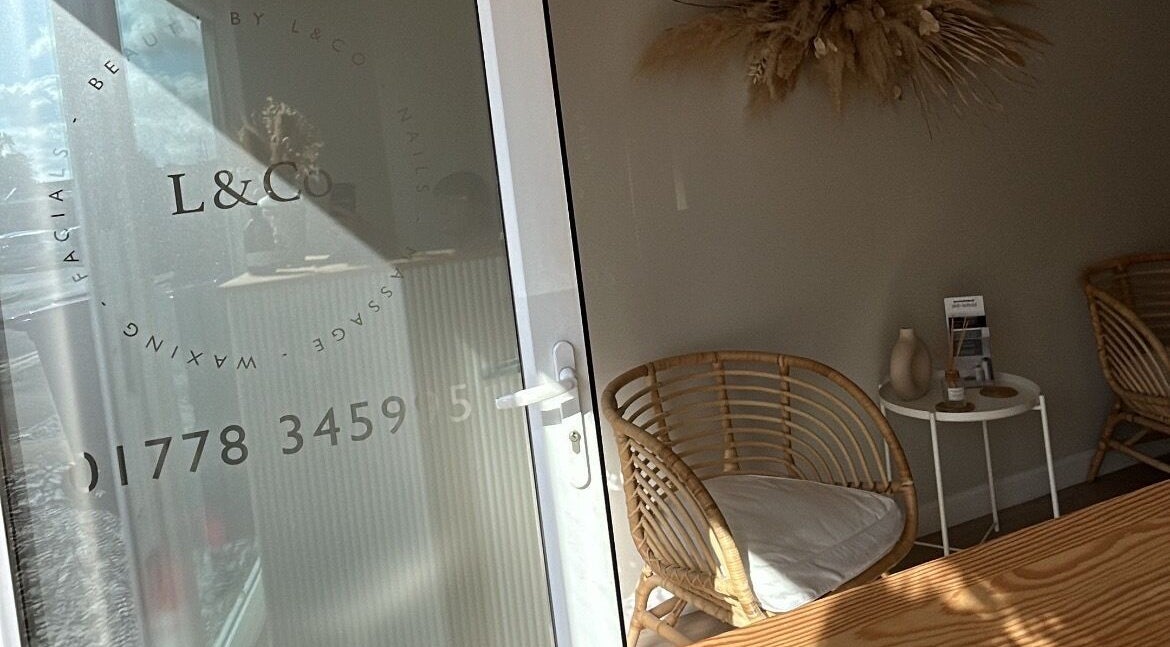 Entrance to Beauty by B in Market Deeping, England, GB, featuring chic wicker seating and decor.