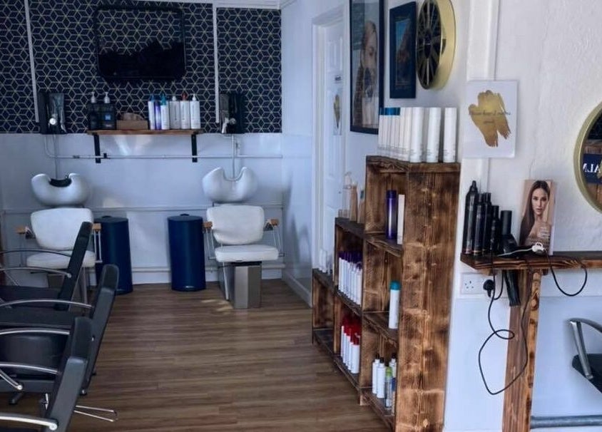 Interior of Calmante salon in Truro, England, GB showcasing modern hair styling stations.