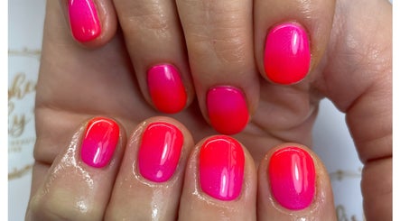Vibrant neon pink gel nails by Polished Pinky's in Taverham, England, GB for a trendy, eye-catching look.