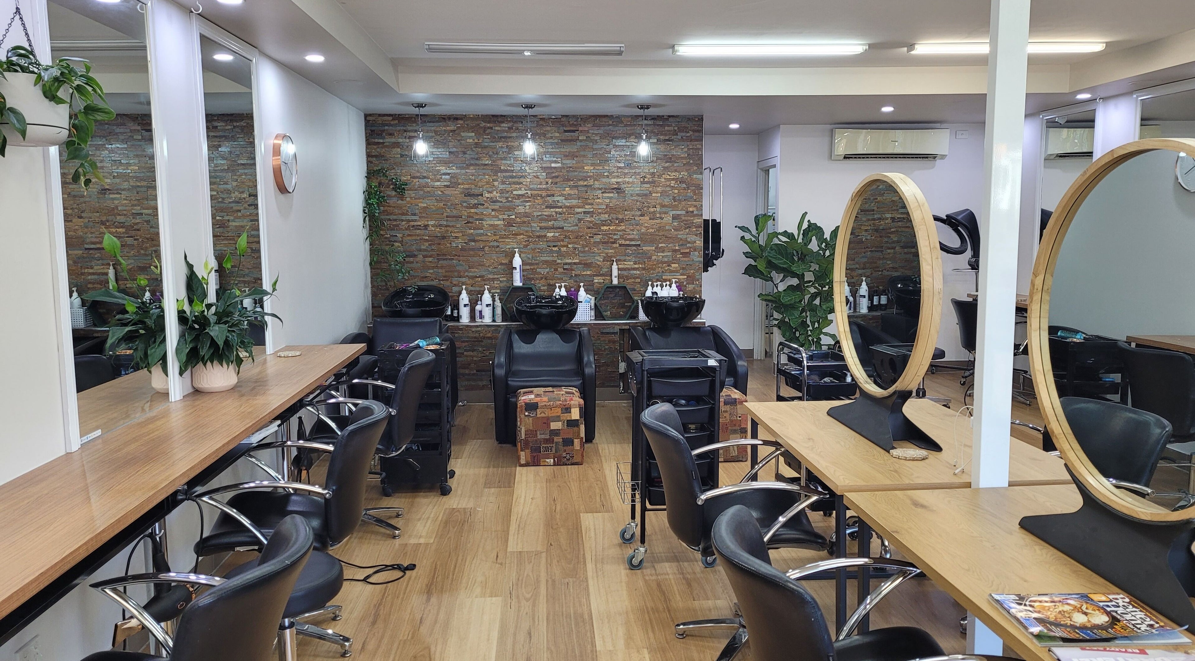 Modern styling area at To Dye 4 Hair Studio, Melbourne, Victoria, AU with elegant mirrors and chic chairs.