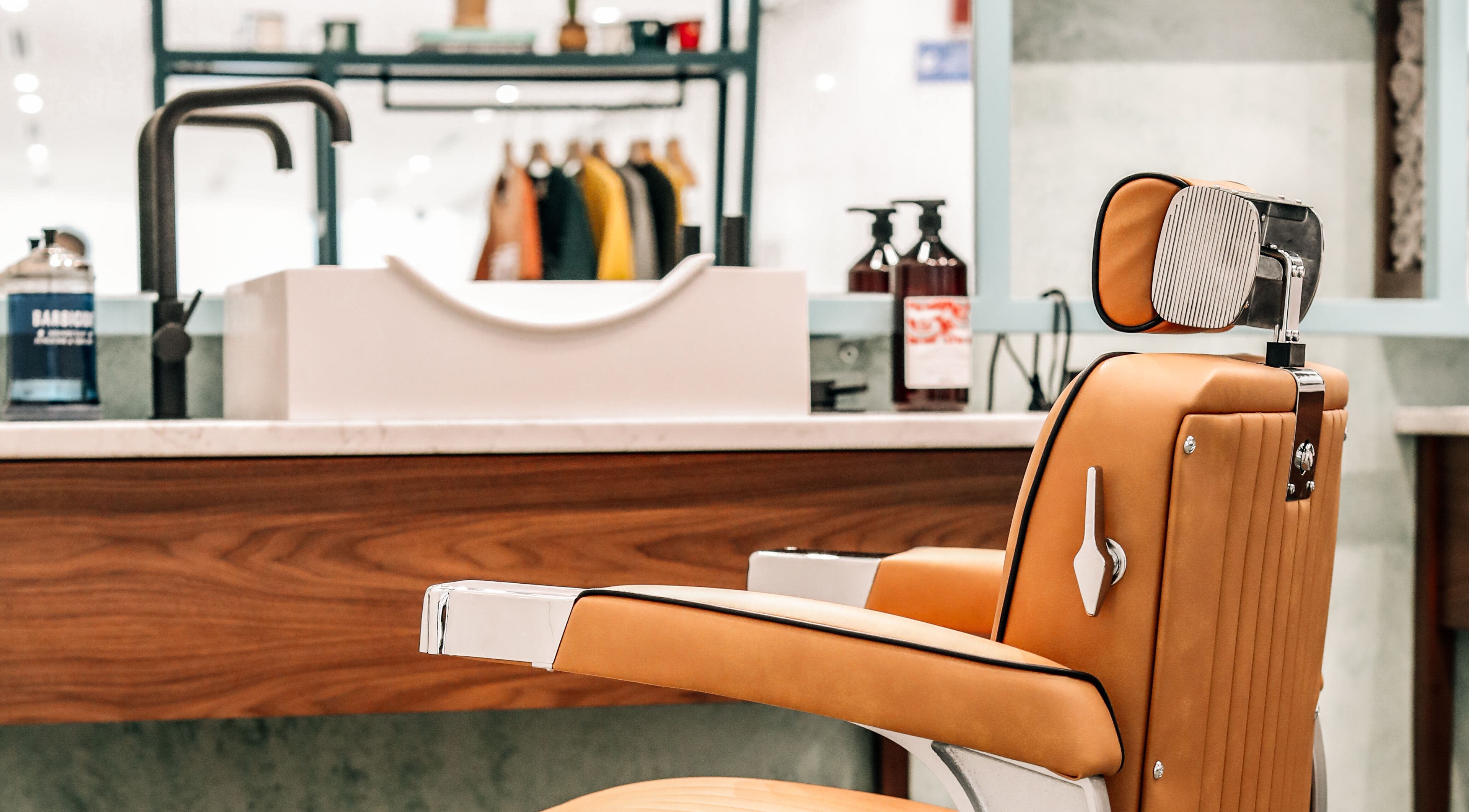 Stylish barber chair at Bo Barbershop, Dubai, AE, showcasing modern design and comfort.