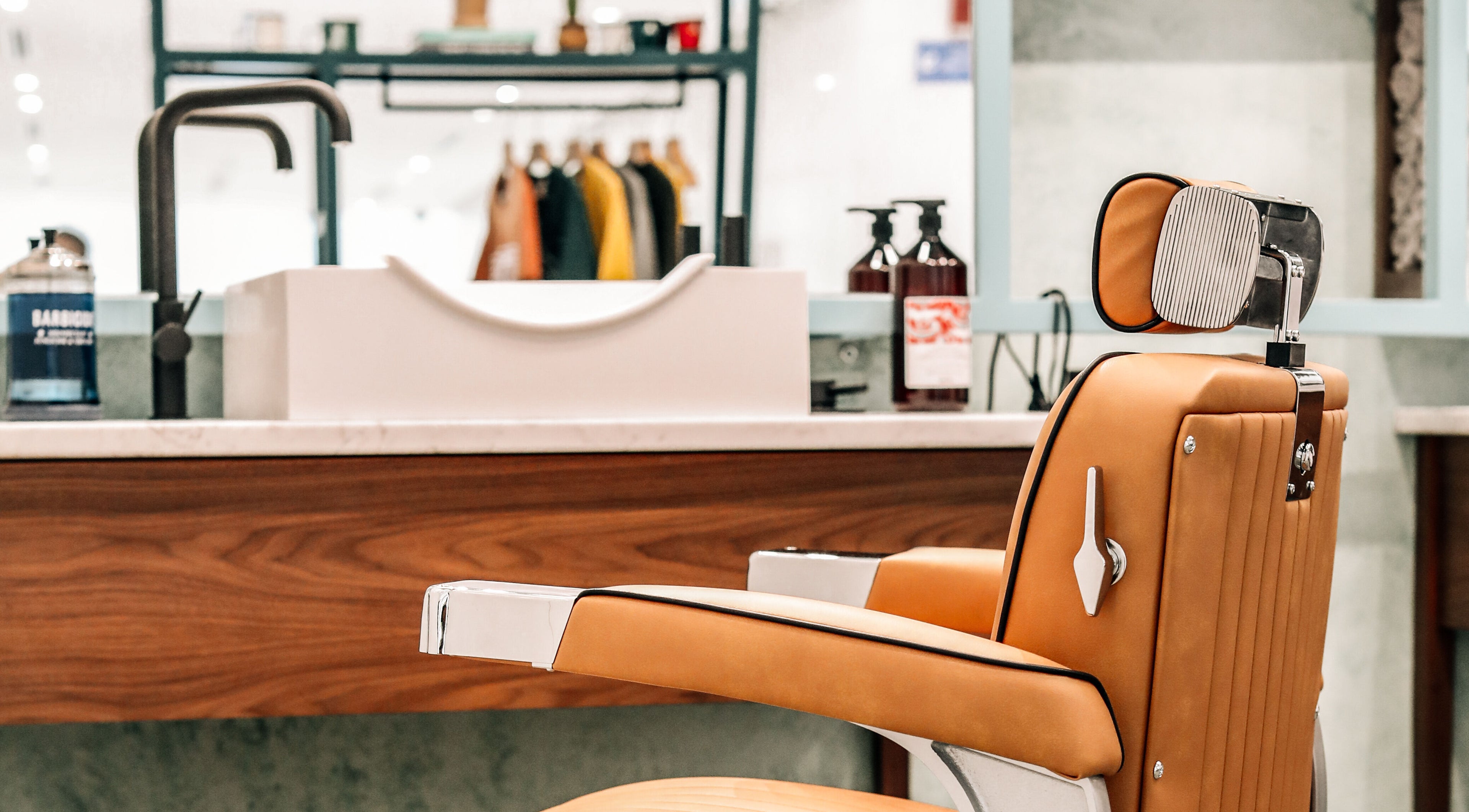 Stylish barber chair at Bo Barbershop, Dubai, AE, showcasing modern design and comfort.