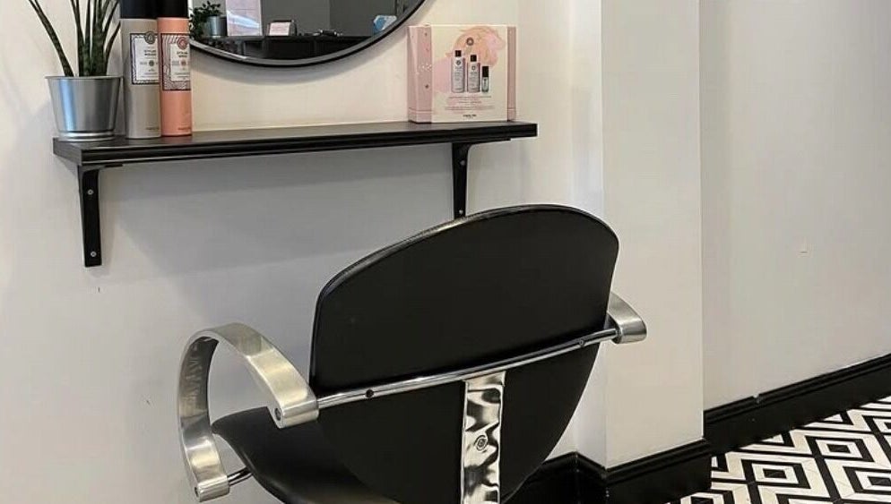 Modern salon chair at Bryony Alexandra ltd, Edinburgh, Scotland, GB, with sleek decor and stylish design.