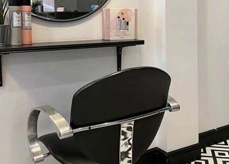 Modern salon chair at Bryony Alexandra ltd, Edinburgh, Scotland, GB, with sleek decor and stylish design.