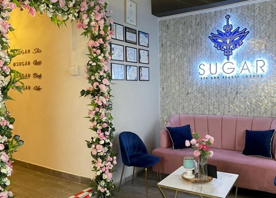 Elegant floral-adorned entrance and seating at Sugar Spa and Beauty Lounge, Tunapuna, Tunapuna/Piarco Regional Corporation, TT.