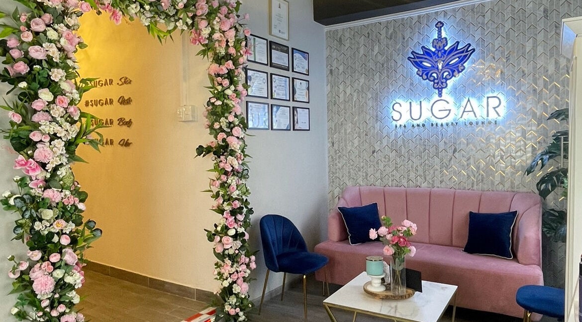 Elegant floral-adorned entrance and seating at Sugar Spa and Beauty Lounge, Tunapuna, Tunapuna/Piarco Regional Corporation, TT.