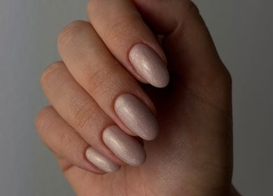 Close-up of elegant manicured nails at Koliya Nails, Wien, Wien, AT showcasing subtle shimmer.