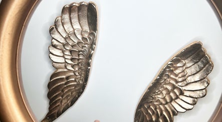 Elegant gold wing decor at S Y SALON Stockton, Stockton-on-Tees, England, GB.