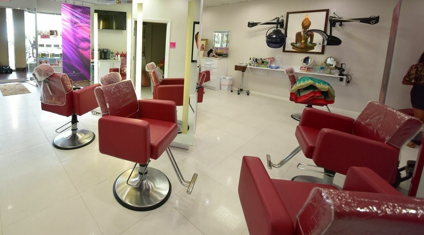 Spacious interior of Shahnaz Husain Franchise Salon in Hicksville, New York, US, featuring modern styling chairs.