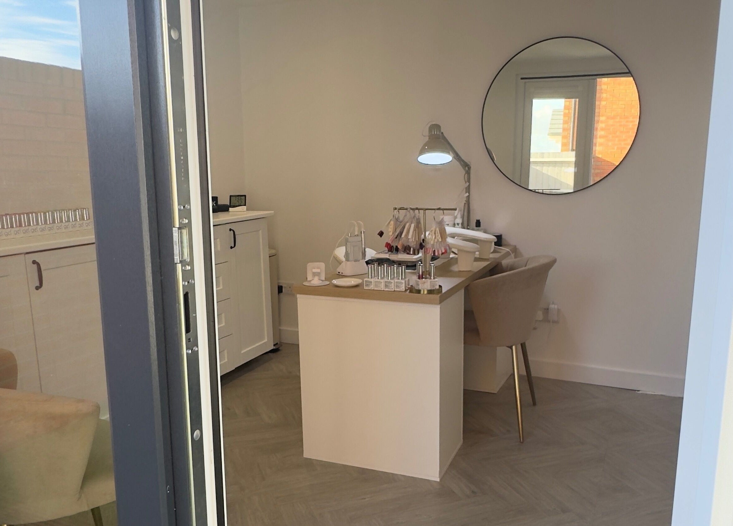 Modern nail studio at LCBeauty, Swindon, England, GB. Features cozy chairs and elegant decor.