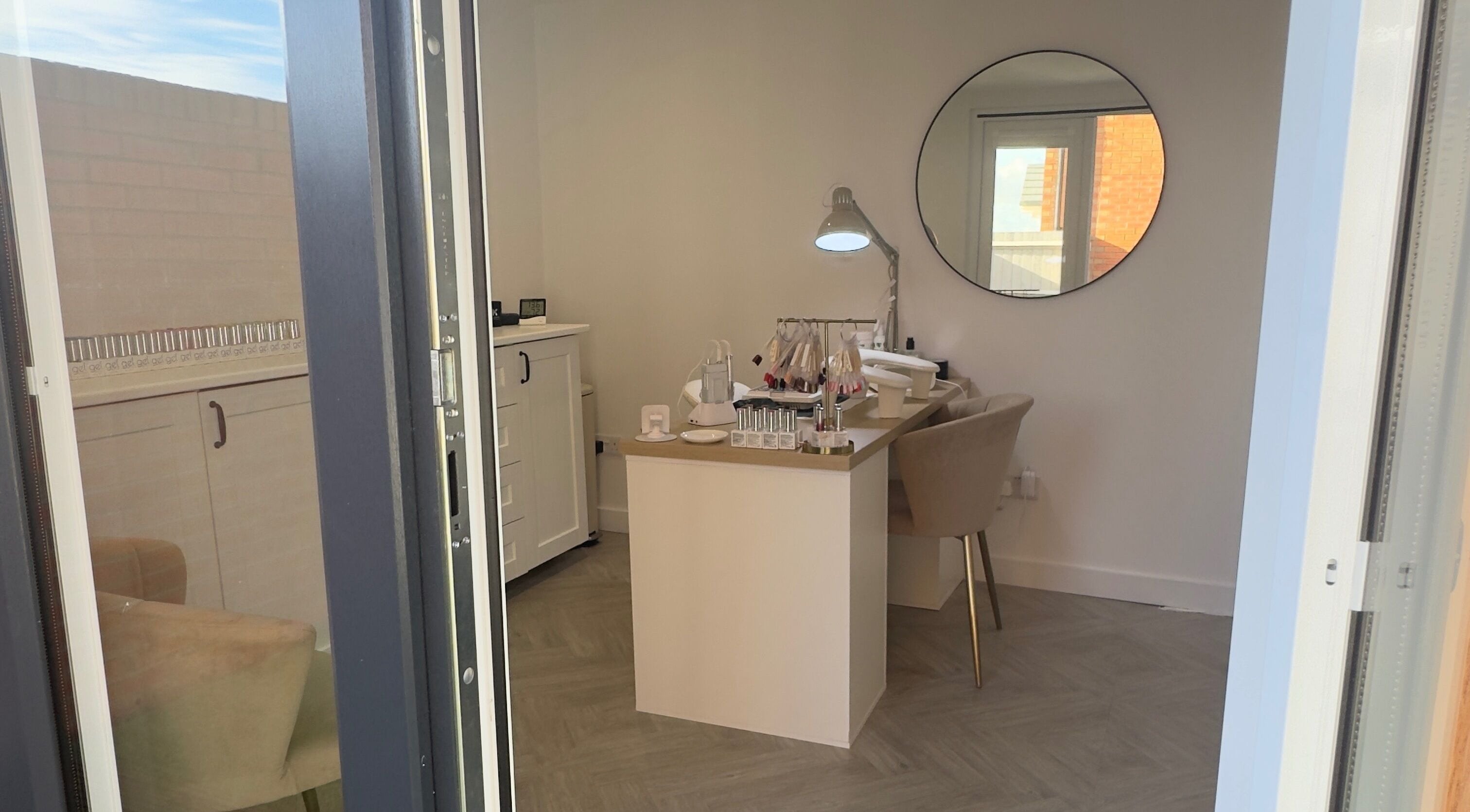 Modern nail studio at LCBeauty, Swindon, England, GB. Features cozy chairs and elegant decor.